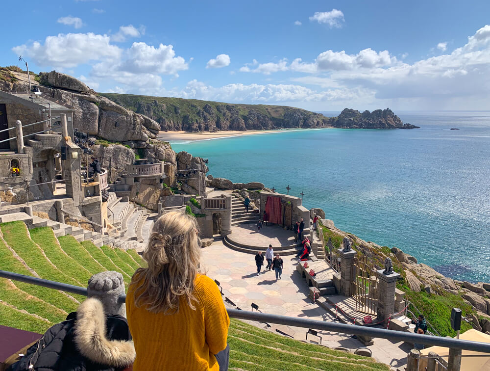 View of my overlooking the Minack Theatre in Cornwall, with blue sky and a sea view