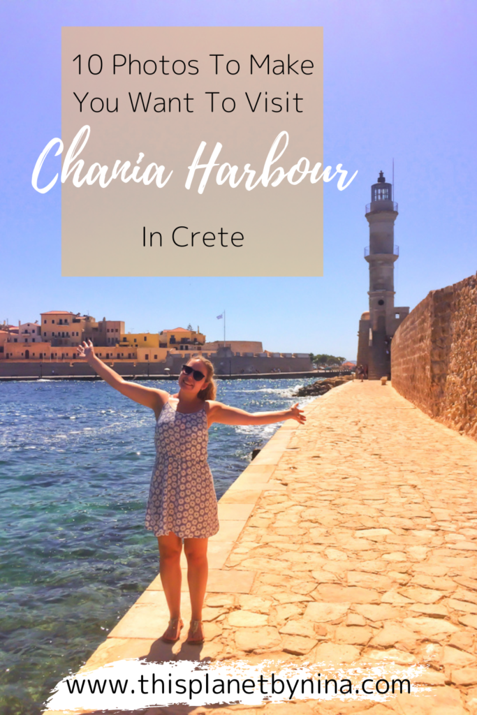 Nina stands with wide open arms, with the sea to the left and a stone wall and pathway leading to Chania's lighthouse on the right. The heading '10 Photos To Make You Want To Visit Chania Harbour In Crete' is at the top.