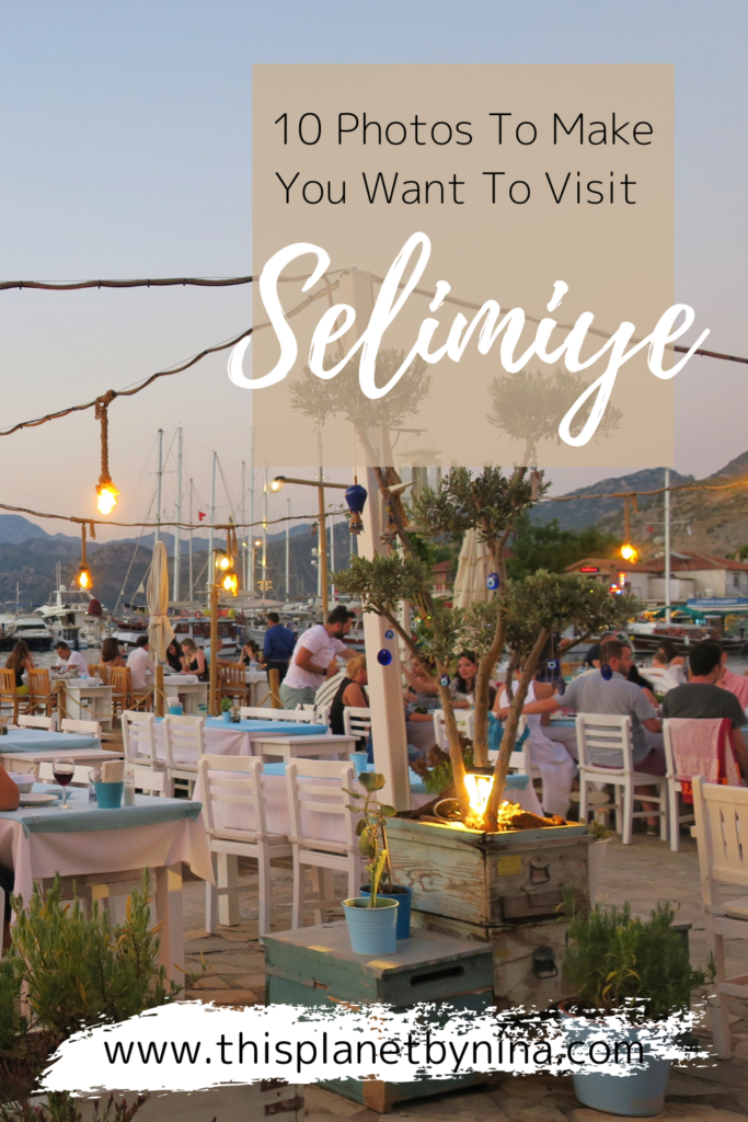 Diners sit at an al fresco restaurant in Selimiye, Turkey, surrounded by mountains, yachts and pretty lights. The heading '10 Photos To Make You Want To Visit Selimiye' is at the top.