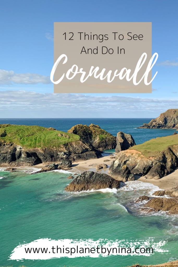 Rocky outcrops and beaches at Kynance Cove in Cornwall jut out into the blue and turquoise sea. The heading '12 Things To See And Do In Cornwall' is at the top.