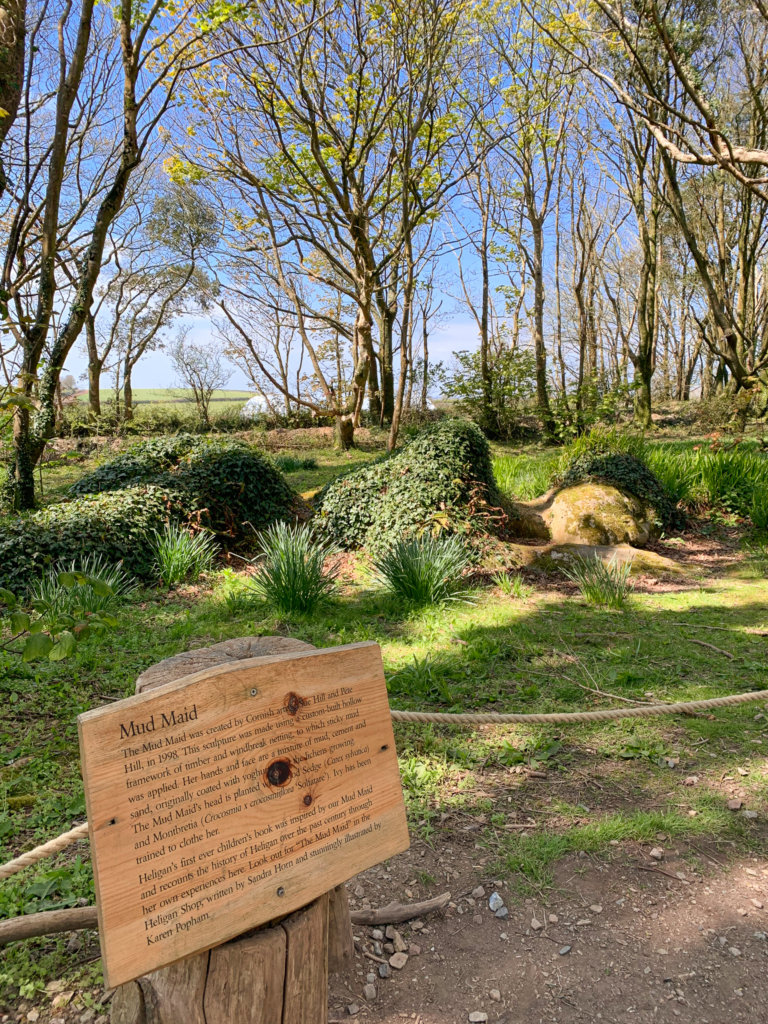 The "Mud Maid" seemingly emerging from the ground in the Lost Gardens of Heligan - a stone, moss and ivy covered sculpture of a woman sleeping on the ground.