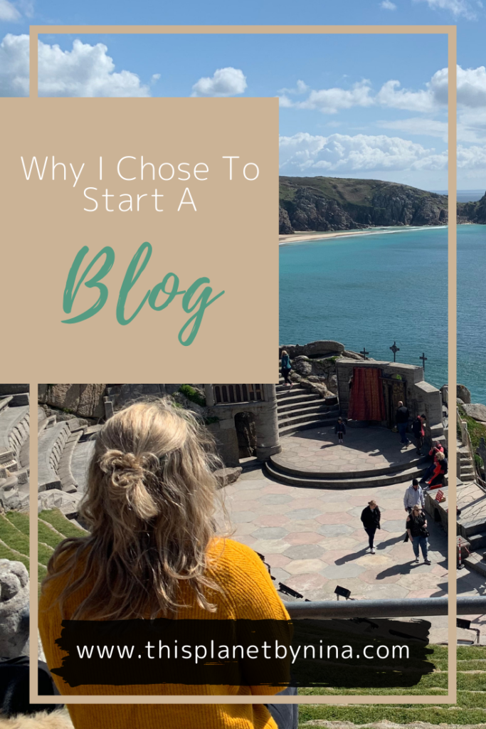 Nina sits with her back to the camera looking out across the Minack Theatre and the blue sea in Cornwall.