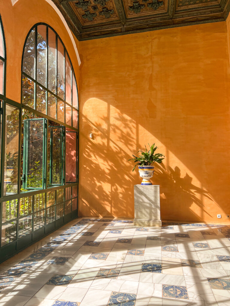 Sun streaming through an arched window in the Real Alcazar - 10 things to do in Seville