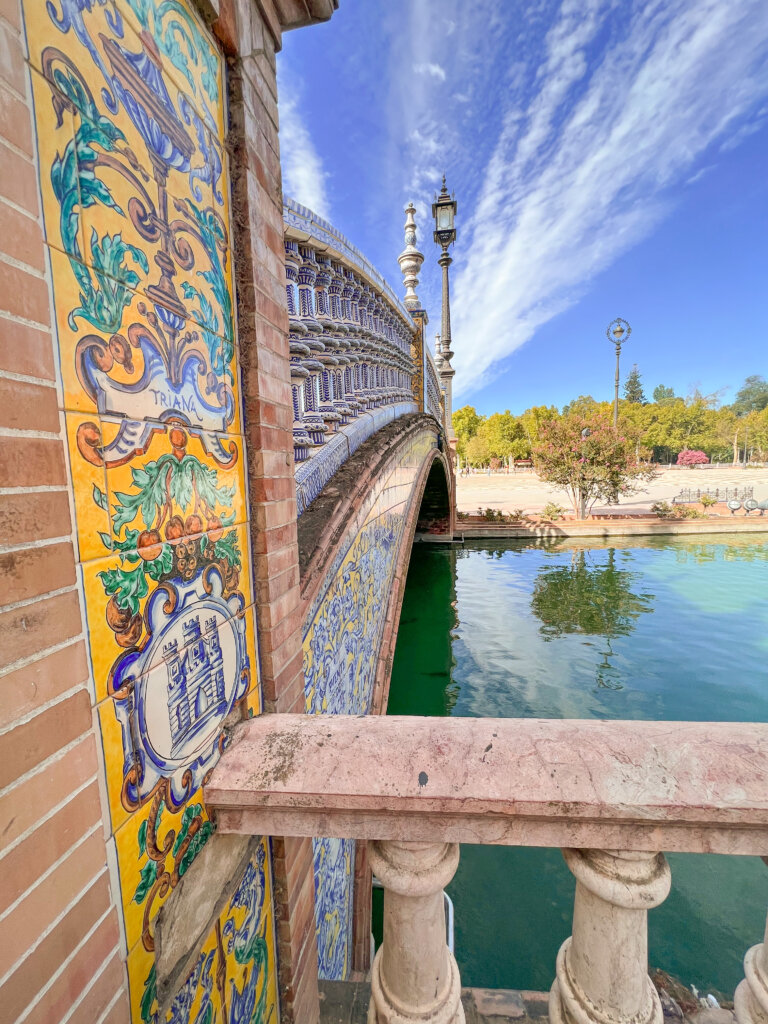 Close up shot of the tiles on the bridge over the canal at La Plaza de España - 10 things to do in Seville.