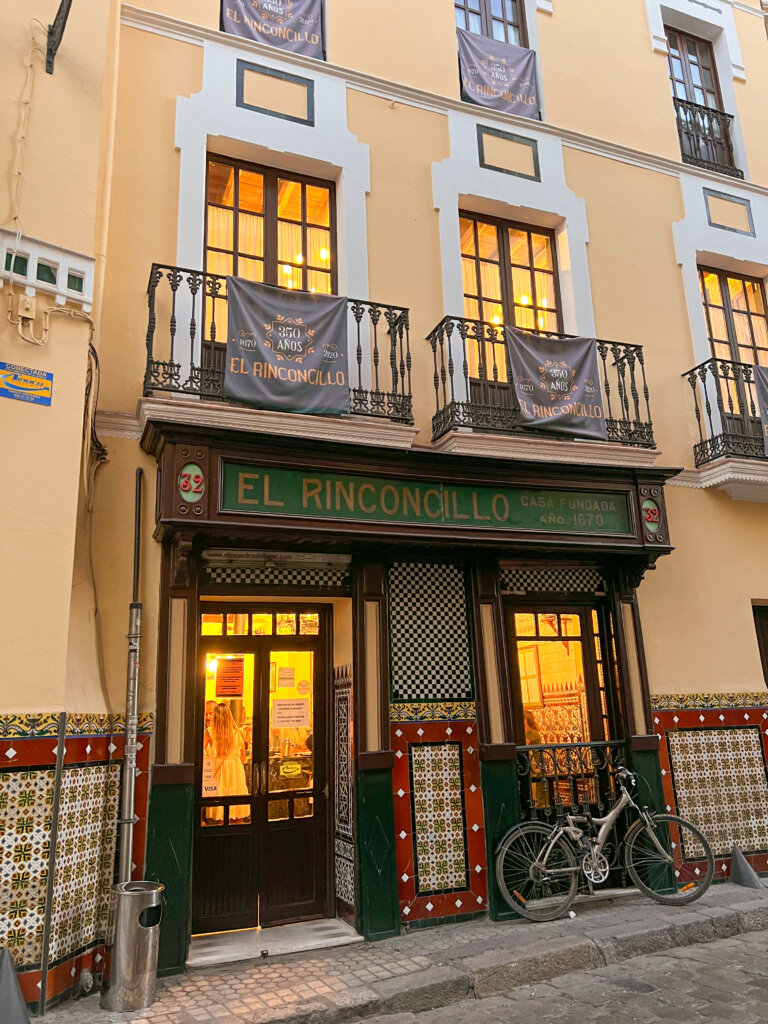 A bike leans against the outside of El Rinconcillo tapas bar - 10 things to do in Seville